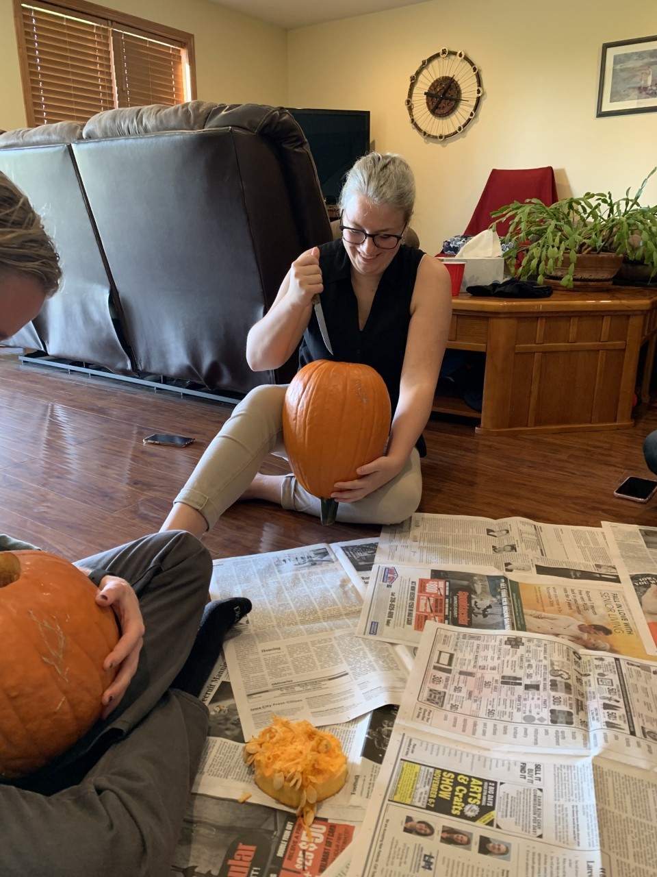 Renee starting to carve her pumpkin