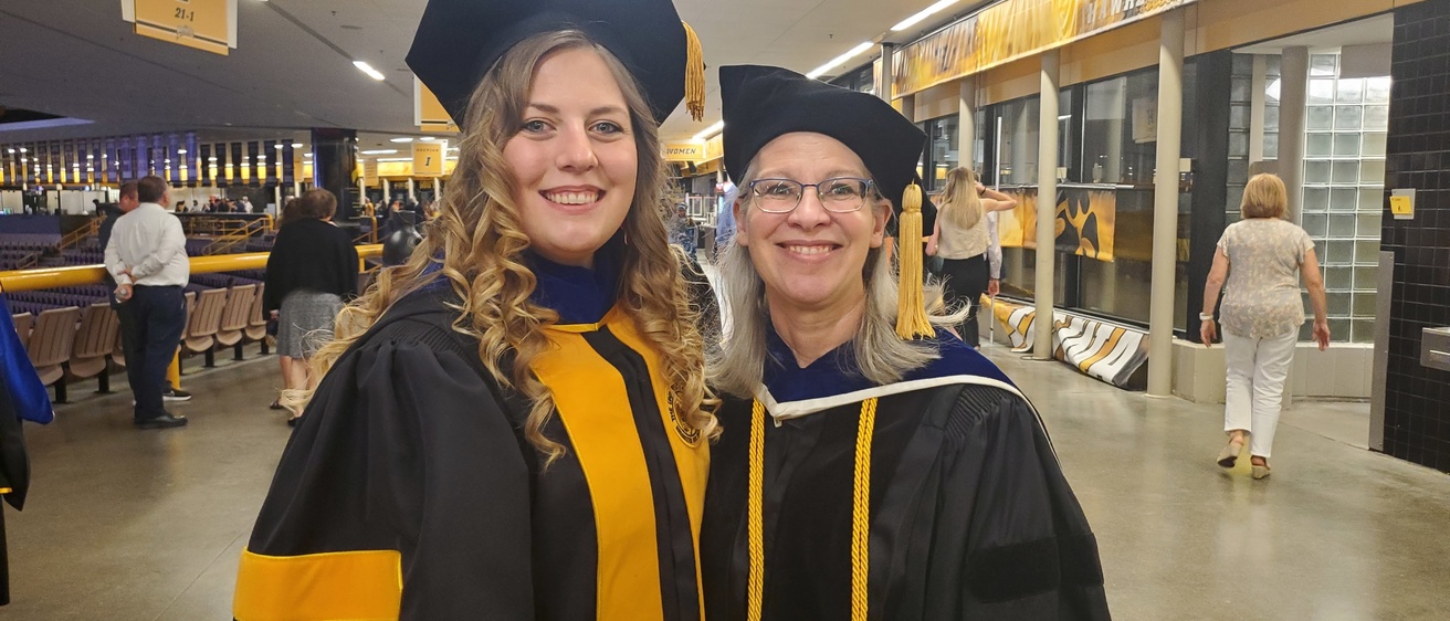 Hannah N with Prof. Cole at 2024 graduation