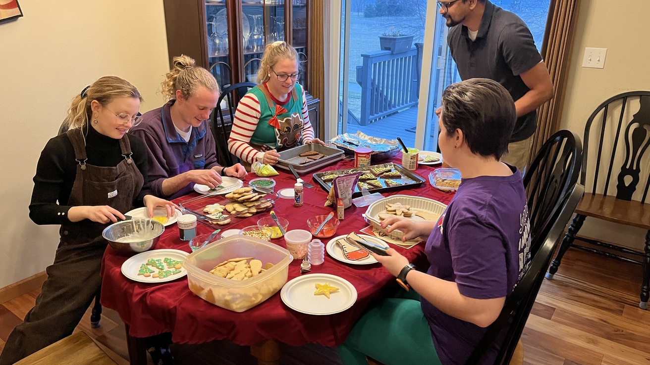 Cole group members decorating cookies